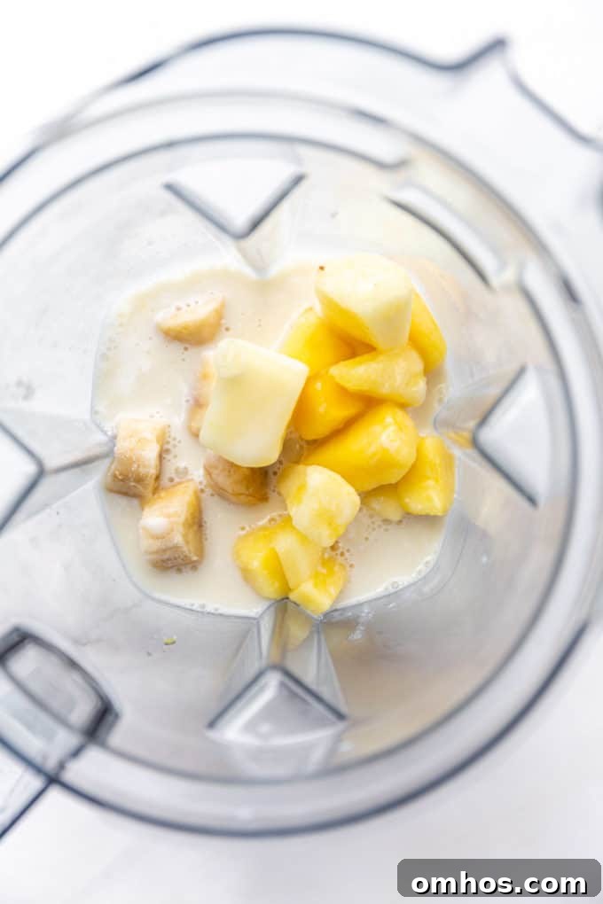 pineapple, banana and coconut milk in a blender