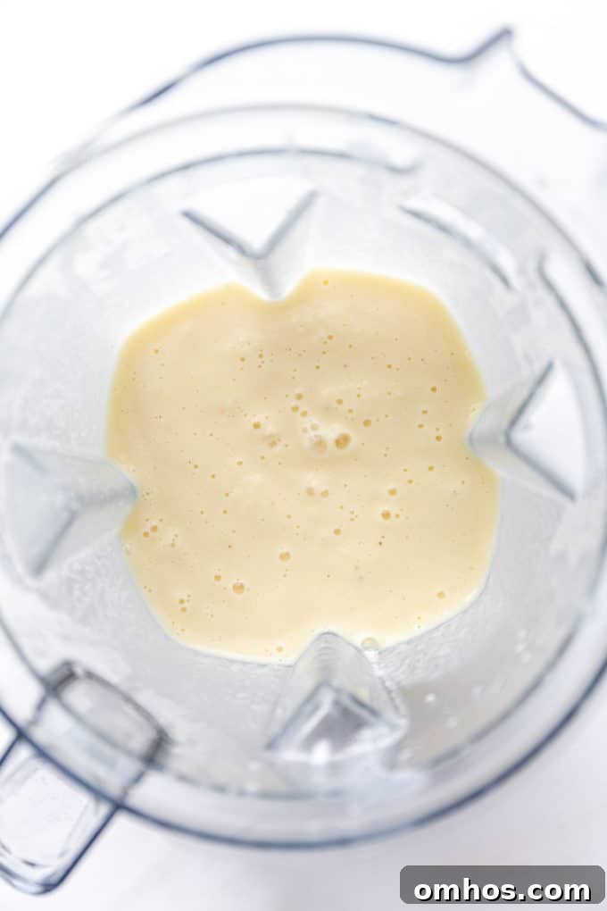 pina colada smoothie in a blender container