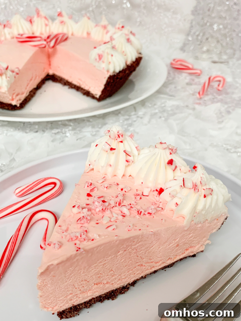 Candy Cane Peppermint Fluff Pie Recipe 12 Peppermint fluff pie, easy best peppermint pie, Peppermint no bake Christmas pie, 6 ingredient peppermint pie, easy to make 10 minute pie, best easy Christmas frozen peppermint pie, candy cane pie, best easy candy cane peppermint pie