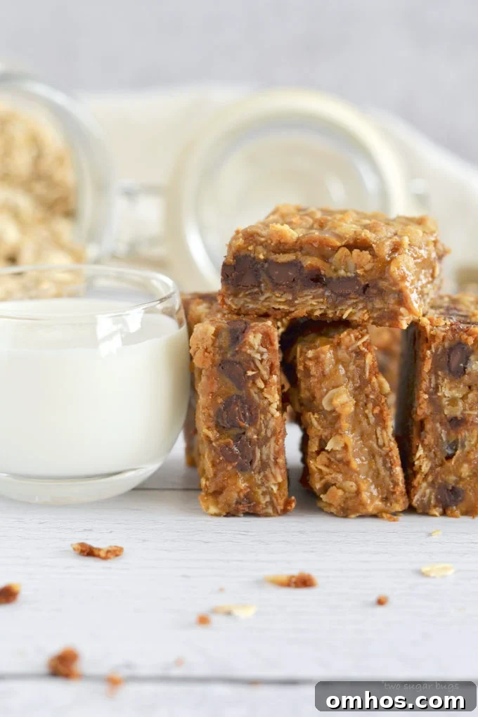 Pumpkin caramel spice bars leaned next to a glass of milk.