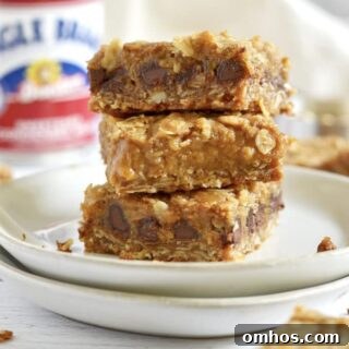 Stack of three pumpkin caramel spice bars on a plate.