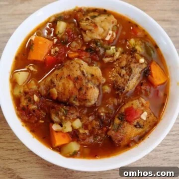 mediterranean chicken stew served in a white bowl.