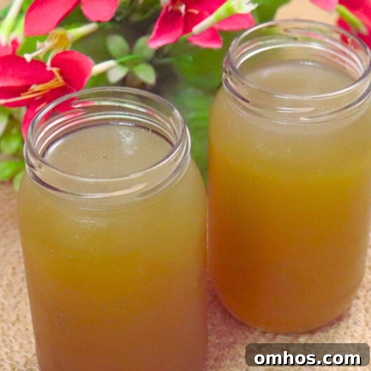 Two bottles of homemade chicken stock cooled and ready to store.