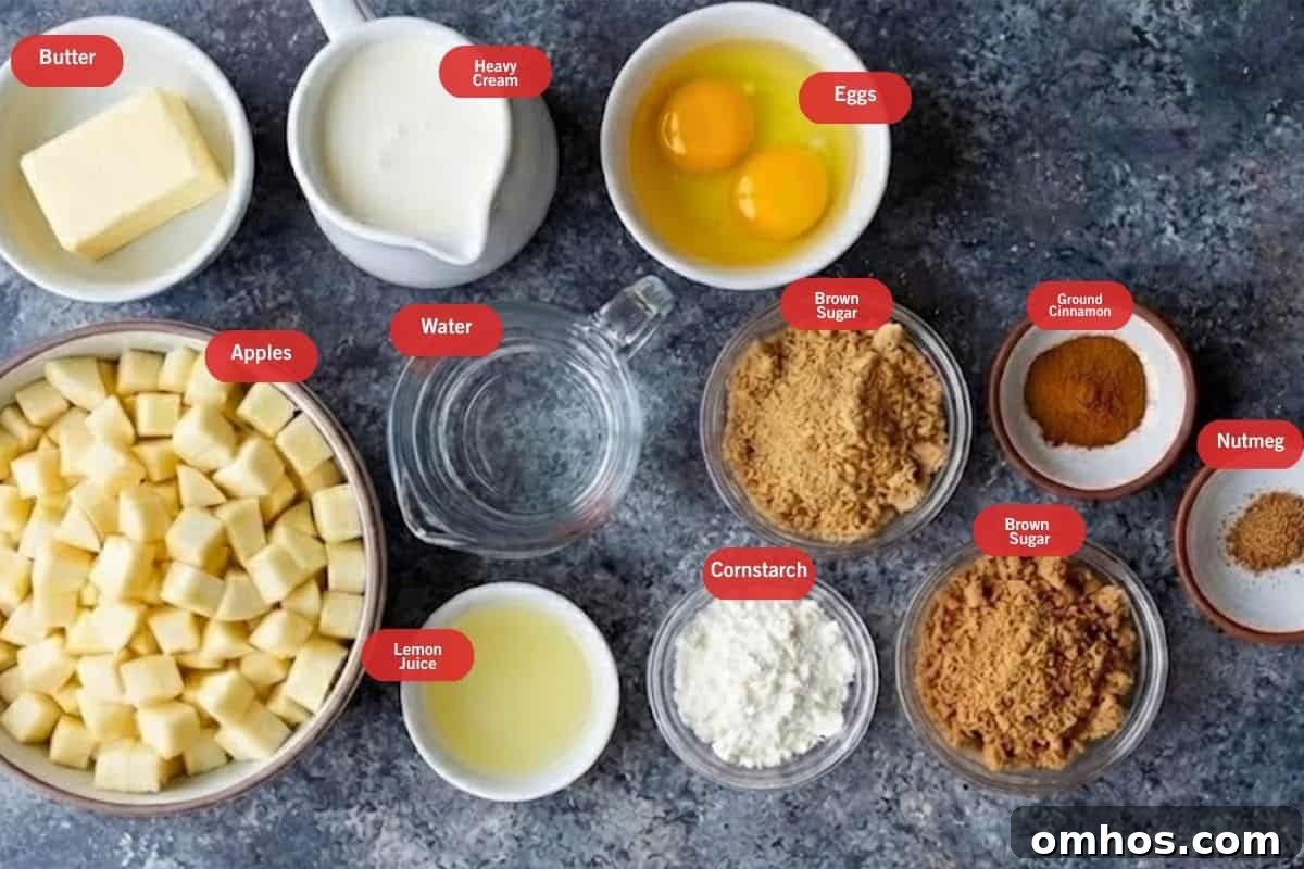 Flat lay photo of ingredient shot of butter, heavy cream ,eggs, apples, lemon juice, brown sugar, cornstarch, ground cinnamon, nutmeg, water