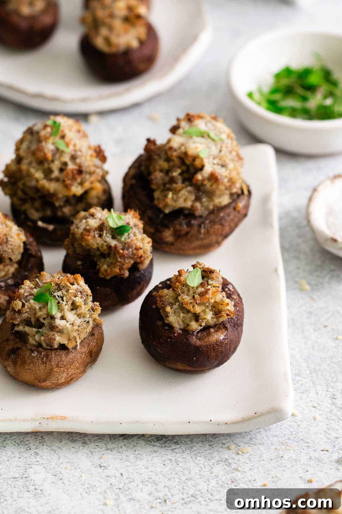 A close-up of stuffed mushrooms on a platter