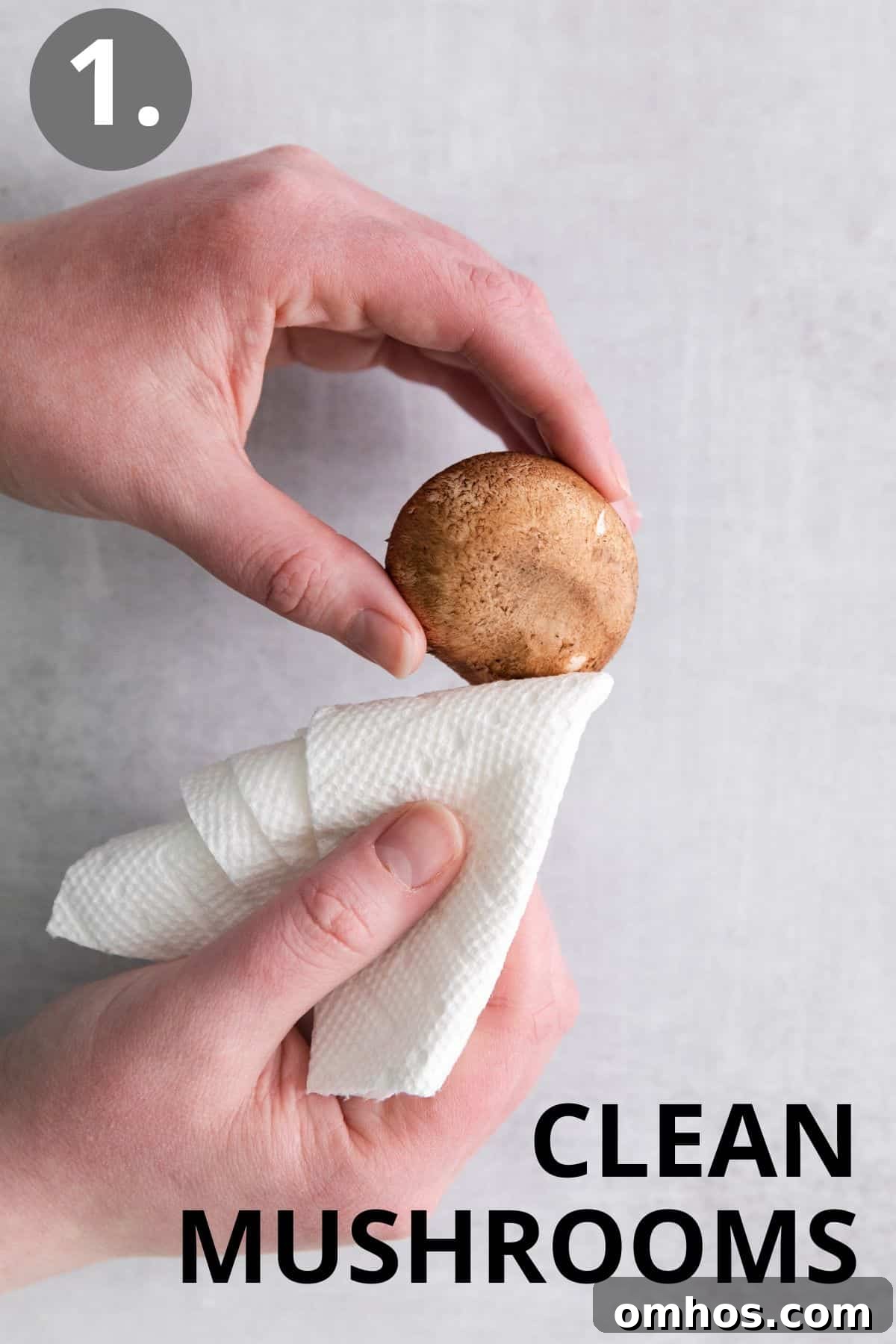 a person cleaning mushrooms with a cloth