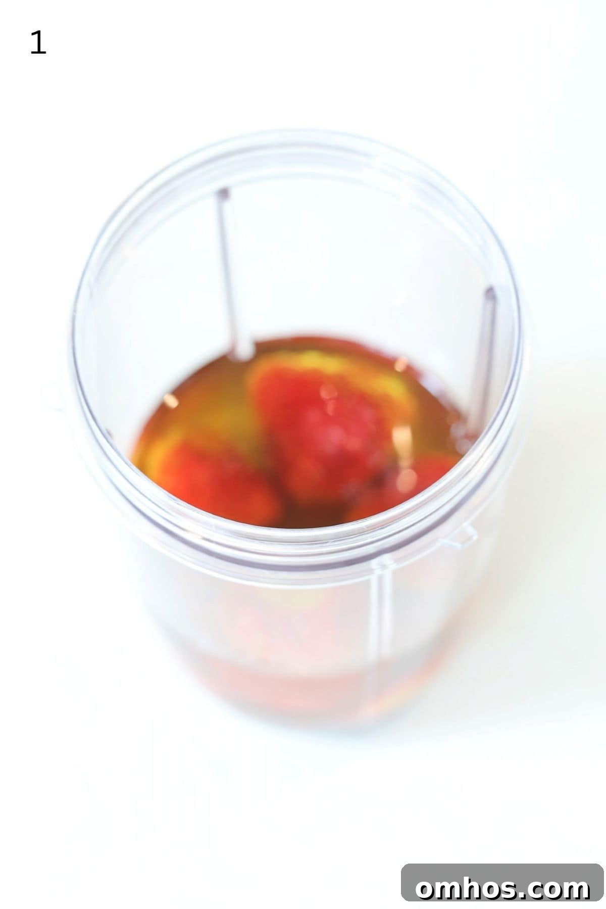 Homemade Strawberry Balsamic Vinaigrette Recipe 4 Strawberry salad dressing ingredients in a Nutri bullet blender container.