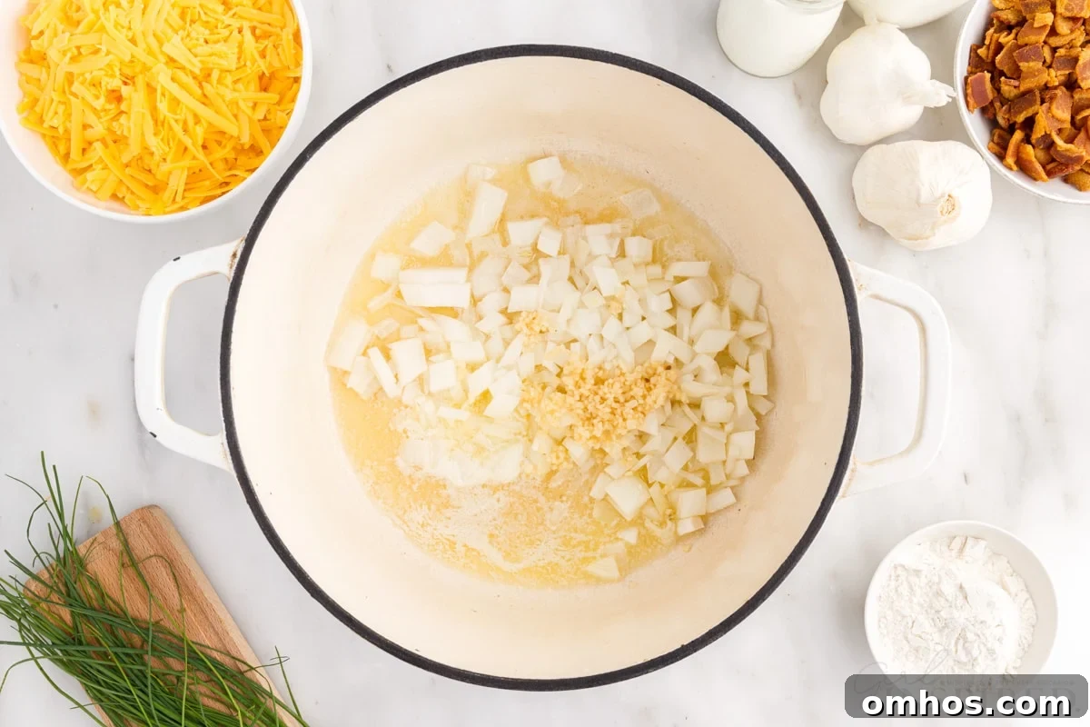 onions and garlic added to melted butter in dutch oven next to additional ingredients needed to make bacon cheddar potato soup
