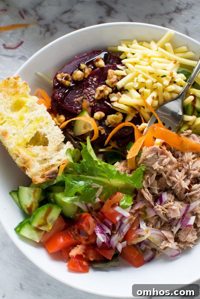 Blueberry Spinach Salad with Bacon and Avocado 7 Easy tuna salad in a white bowl from above