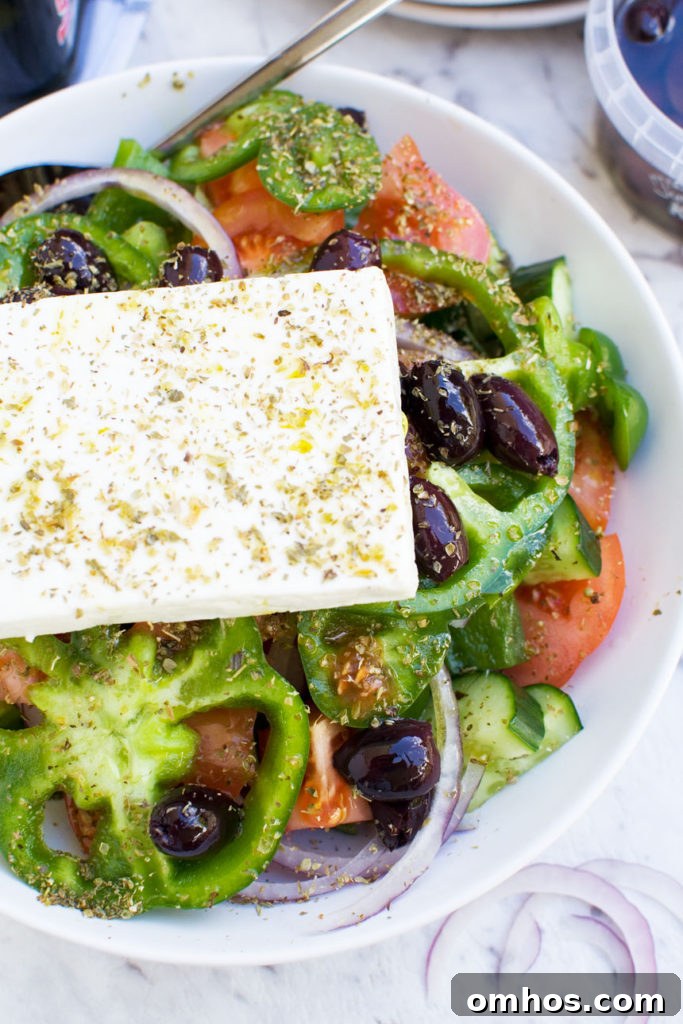 Blueberry Spinach Salad with Bacon and Avocado 8 Greek salad in a white dish from above