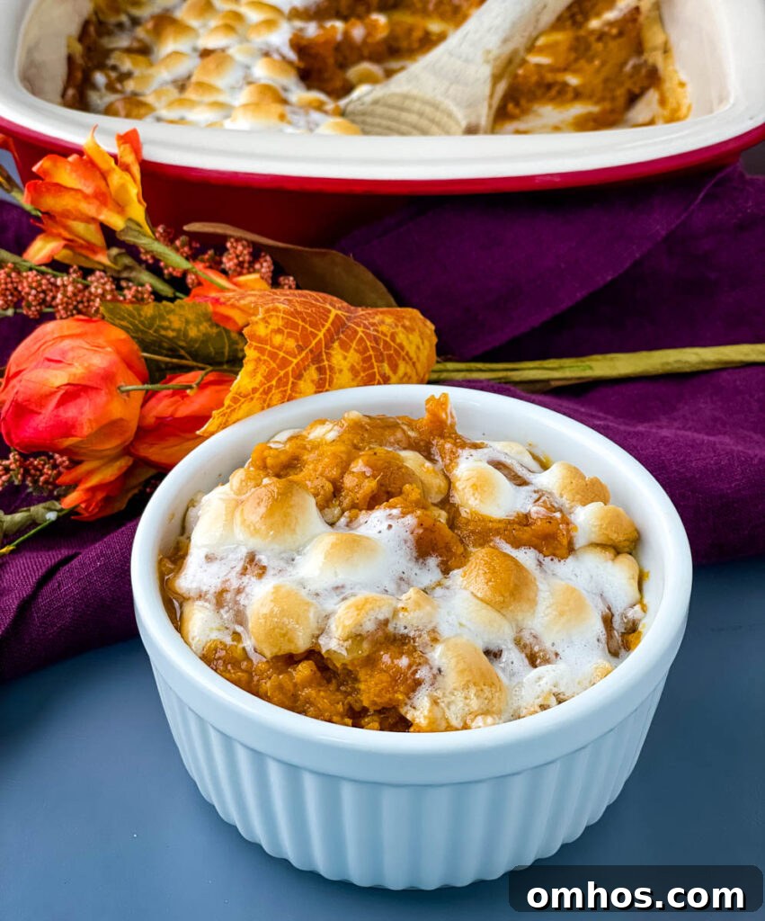 Southern Sweet Potato Casserole with Pecan Streusel 2 sweet potato casserole with marshmallows in a white dish