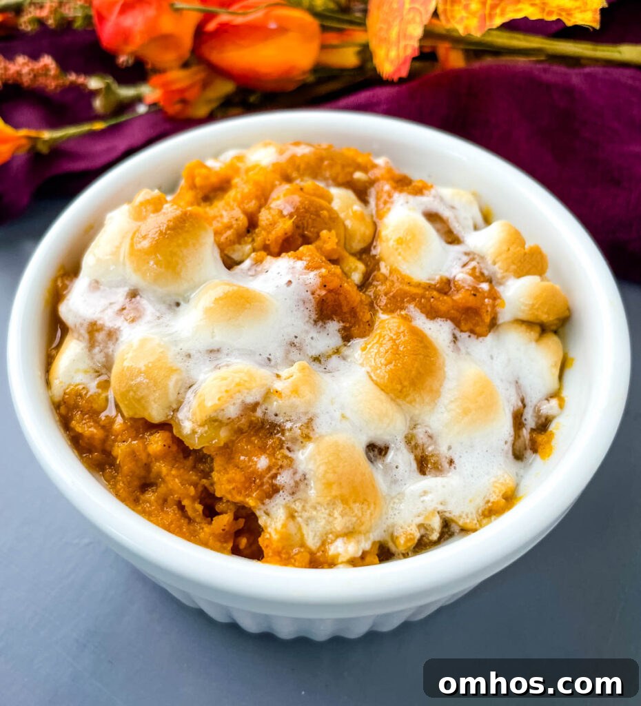 Southern Sweet Potato Casserole with Pecan Streusel 9 sweet potato casserole with marshmallows in a white dish