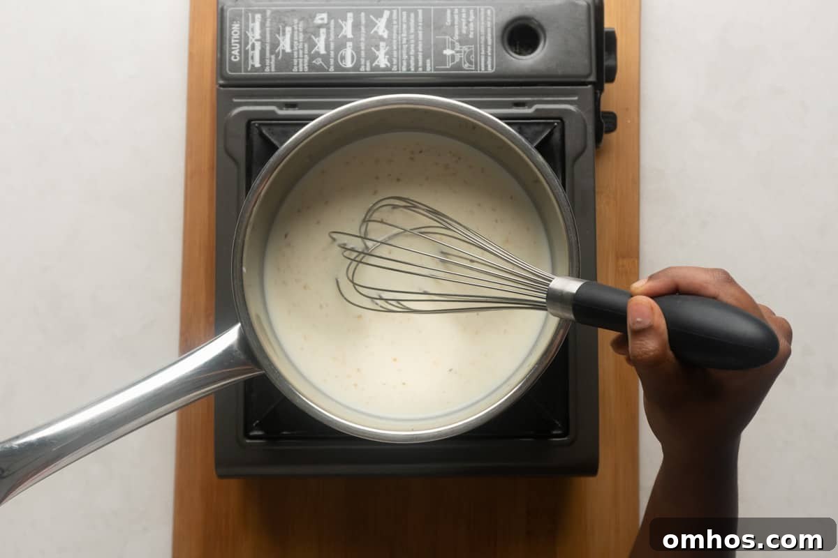 Picture showing whisking of milk to incorporate nutmeg