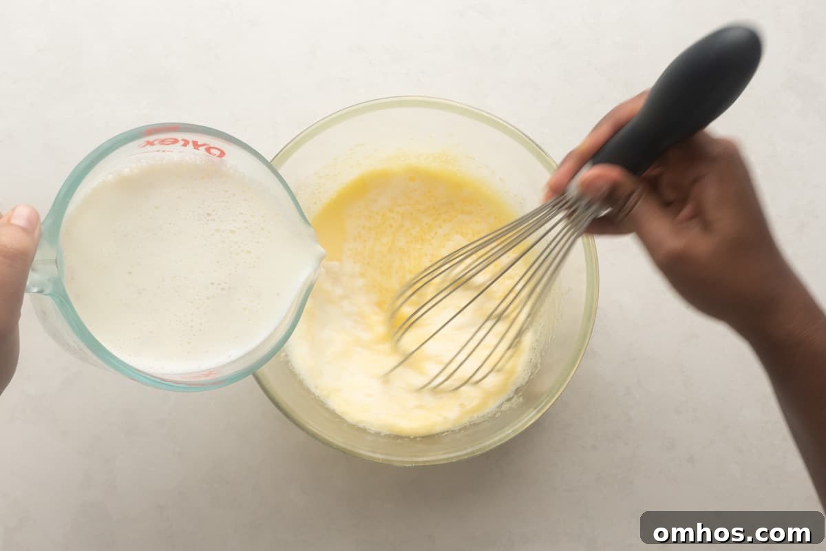 Picture showing how to temper yolks with milk