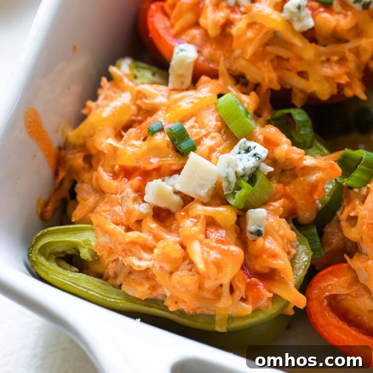 stuffed bell peppers in a white casserole dish
