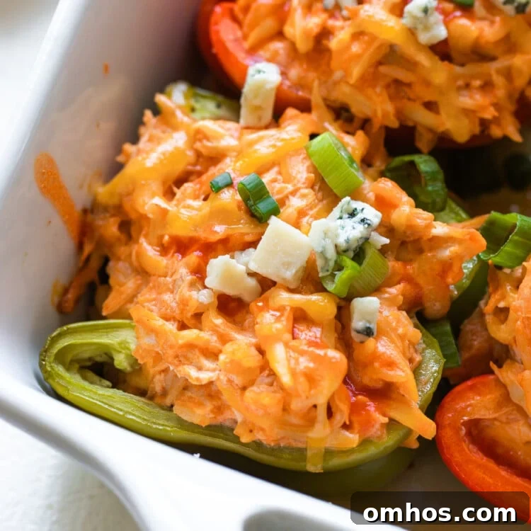 stuffed bell peppers in a white casserole dish