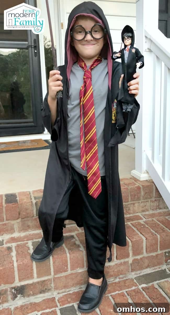 Harry Potter Toys and Gift Ideas for Fans 3 A small boy standing on brick steps dressed up as Harry Potter.