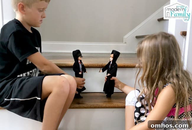 Harry Potter Toys and Gift Ideas for Fans 9 Two children playing with Harry Potter figurines on wooden steps.