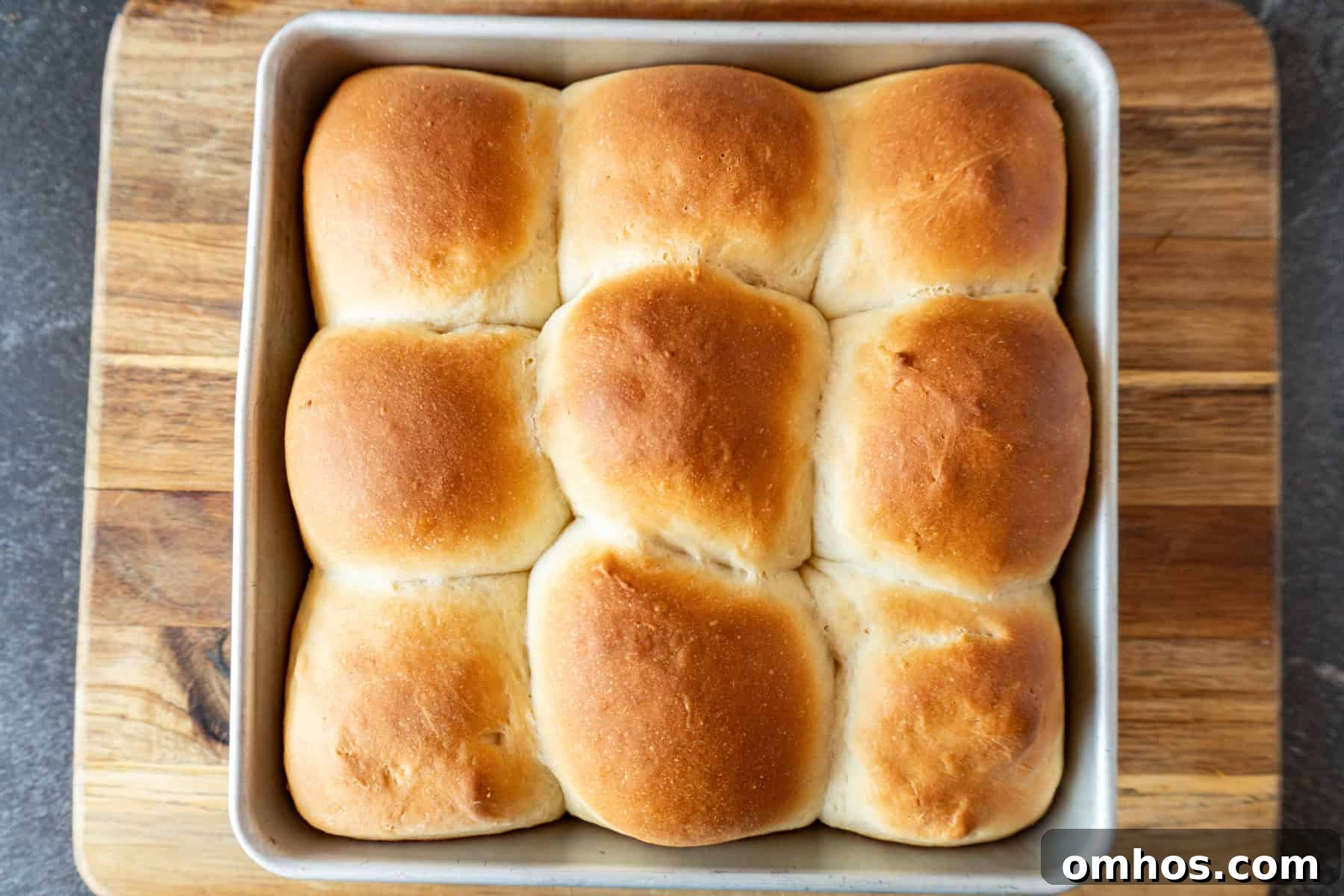Fluffy Soft Dinner Rolls: Buttery Homemade Recipe 14 baked soft dinner rolls with golden tops.