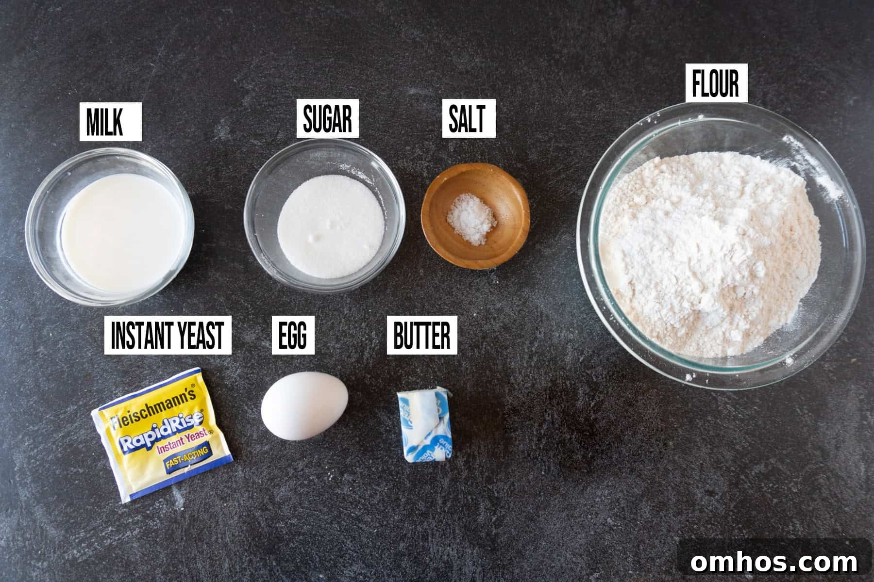 Fluffy Soft Dinner Rolls: Buttery Homemade Recipe 4 Soft Dinner Rolls ingredients laid out and in individual bowls and labeled.