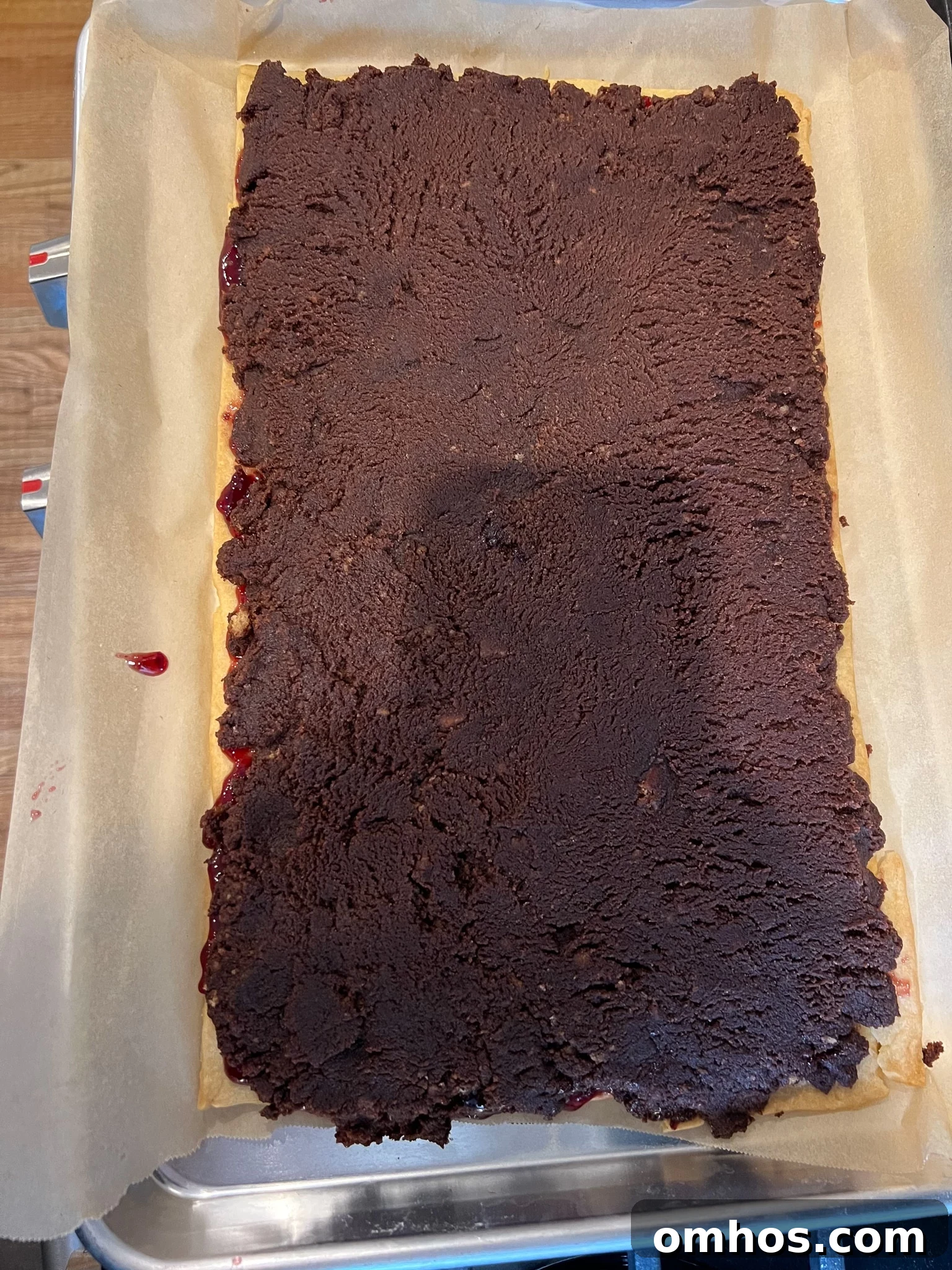 Chocolate leftover cake on top of a pastry base.