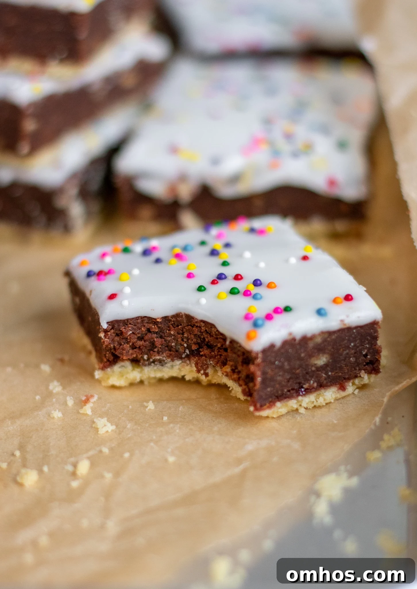 Studenterbrød: Norwegian Student Bread Pastry Recipe 3 Pastries with chocolate cake and icing.