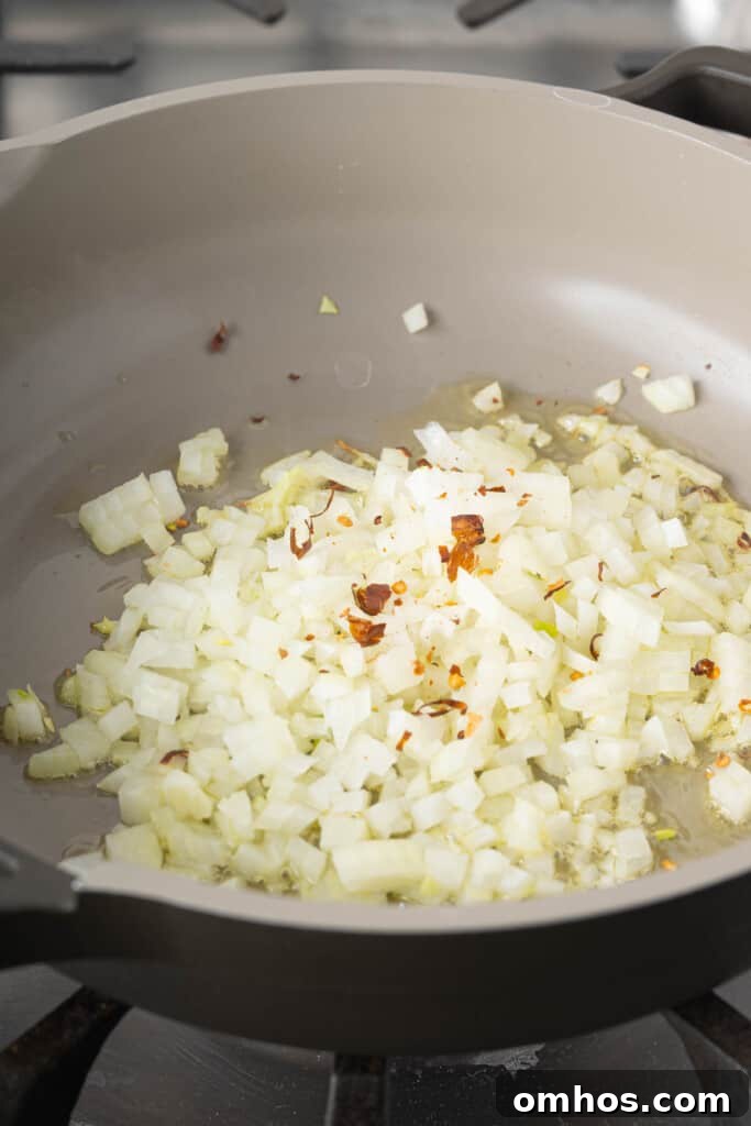 Turmeric Basmati Rice Recipe: Light and Fluffy 2 Onions and peppers in a pan