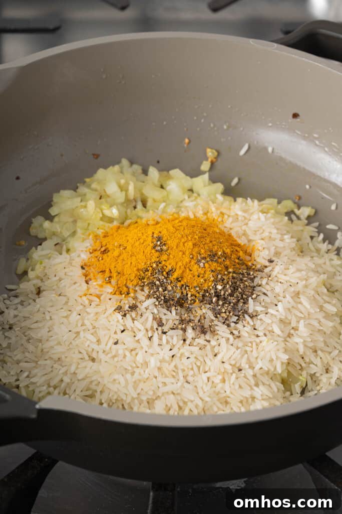 Turmeric Basmati Rice Recipe: Light and Fluffy 4 rice and spices in a pan
