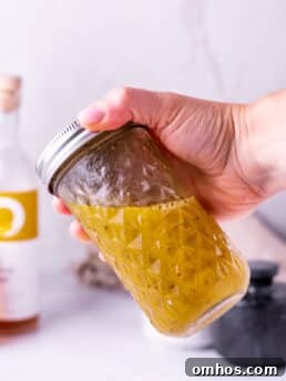 hand shaking white balsamic vinaigrette