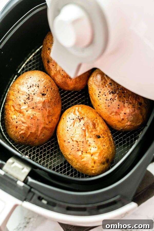 Baked potatoes in an Air Fryer. They are fast to prepare. Put them in the Air Fryer and they are done in no time.