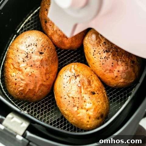 These Air Fryer Baked Potatoes are fast and delicious. Put them in the Air Fryer and they are done in no time. Load them with your favorite toppings and serve as a side dish.