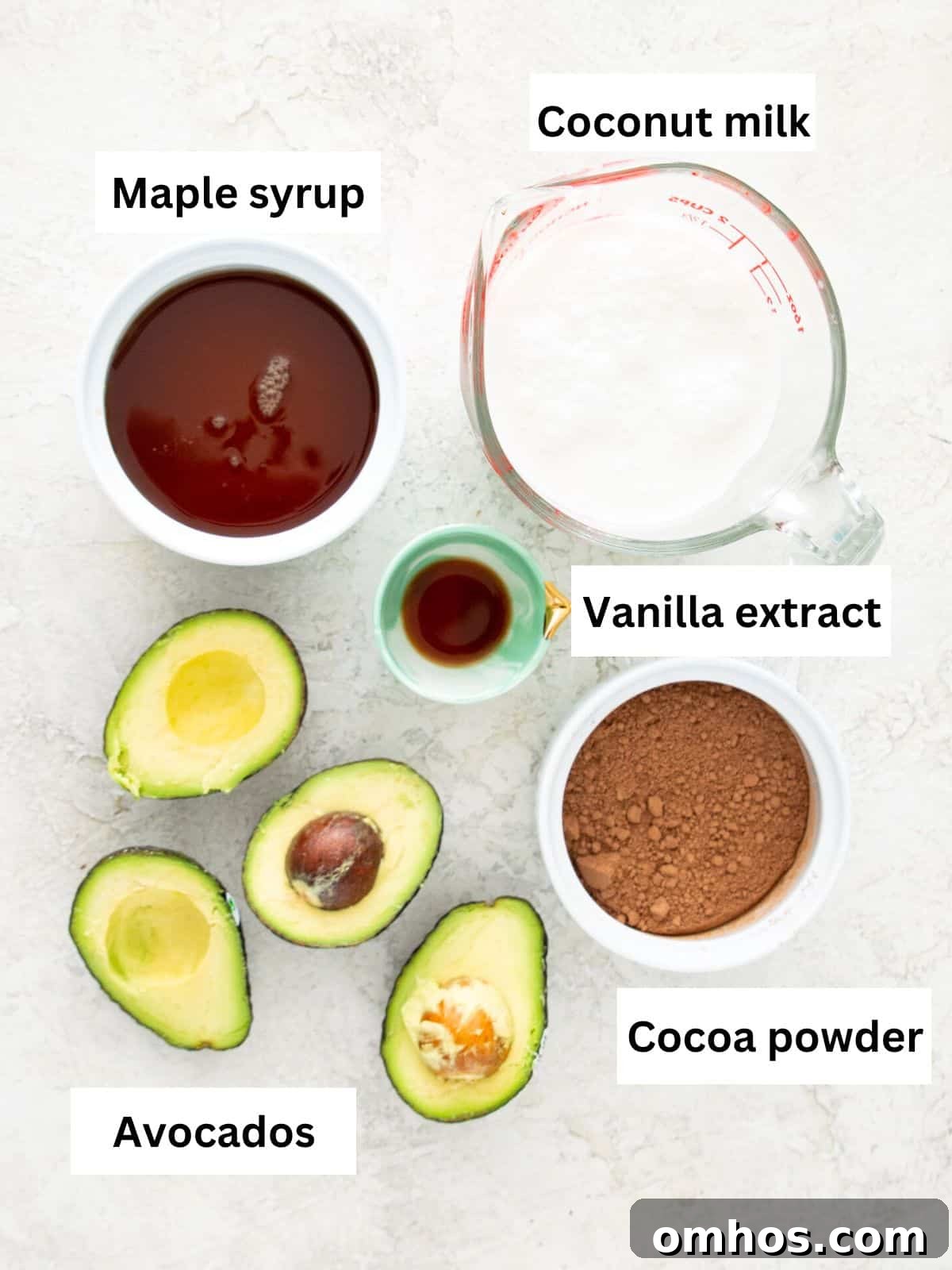 The ingredients needed to make avocado fudgesicles separated into small bowls.