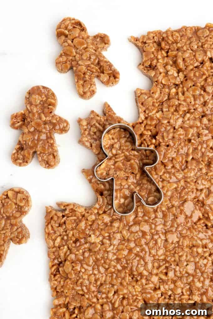 mini gingerbread cookie cutter cutting out star crunch rice krispy bars