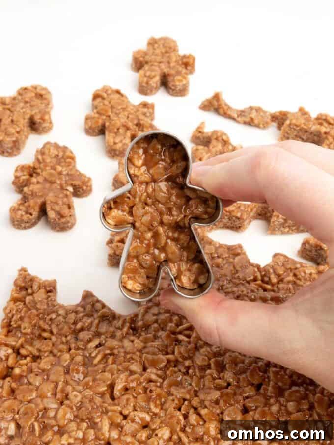 mini gingerbread cookie cutter cutting out star crunch rice krispy bars