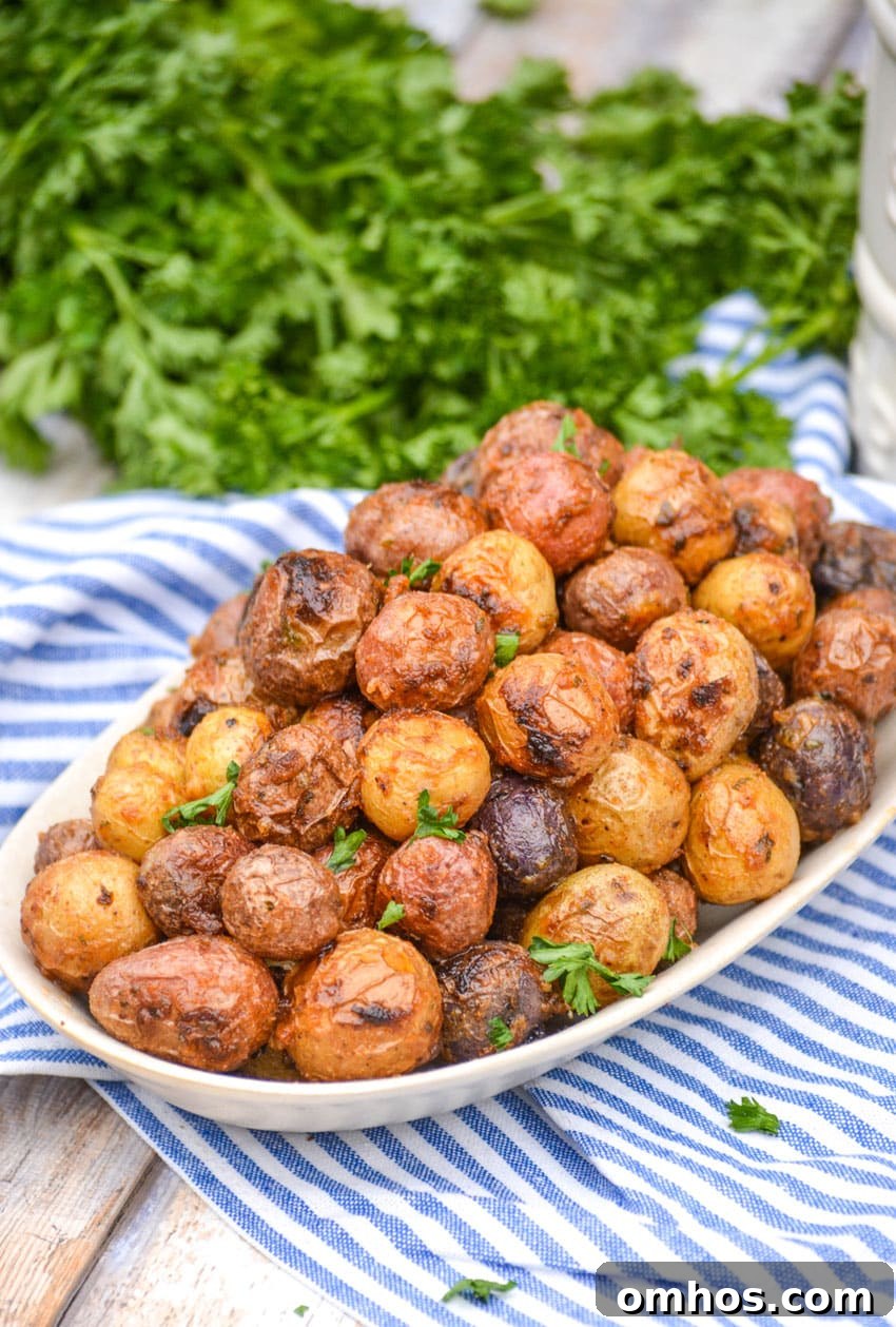 Crispy Roasted Potatoes with Mayonnaise 6 mayonnaise roasted potatoes topped with fresh parsley leaves on an oval serving platter