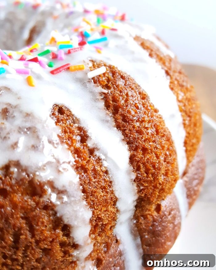 Vanilla Pudding Sour Cream Bundt Cake (Boxed Mix) - Doctored cake mix bundt cake made with sour cream and vanilla pudding. This cake comes out so soft and moist every single time and it tastes like it's homemade! | Beat Bake Eat