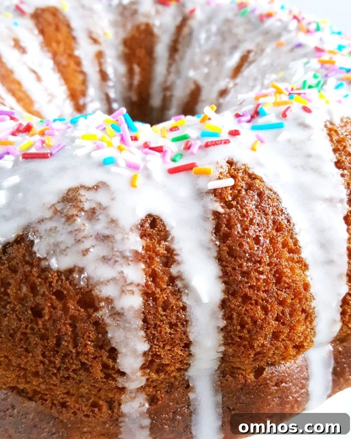 Vanilla Pudding Sour Cream Bundt Cake (Boxed Mix) - Doctored cake mix bundt cake made with sour cream and vanilla pudding. This cake comes out so soft and moist every single time and it tastes like it's homemade! | Beat Bake Eat