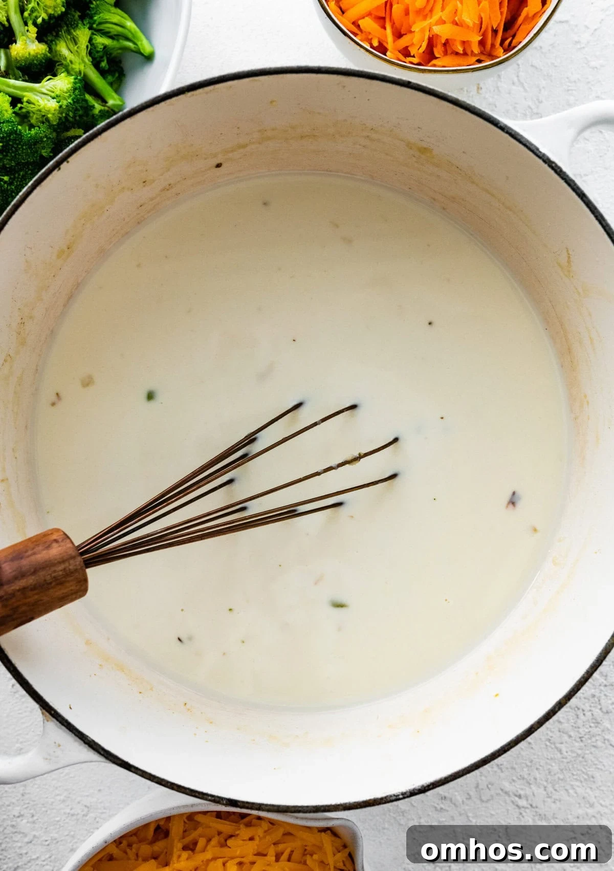 How to Make Copycat Panera Broccoli Cheddar Soup step-by-step: add the milk and cream and thicken.