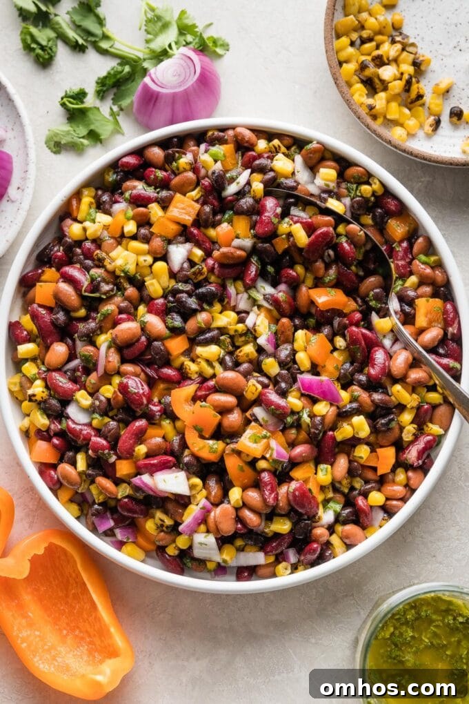 Crispy Baked Chicken and Black Bean Taquitos 3 A large Mexican three bean salad with homemade cilantro vinaigrette, in a white bowl ready to serve.