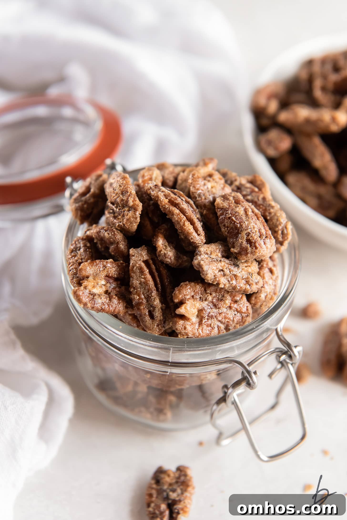 spiced pecans in a glass jar.