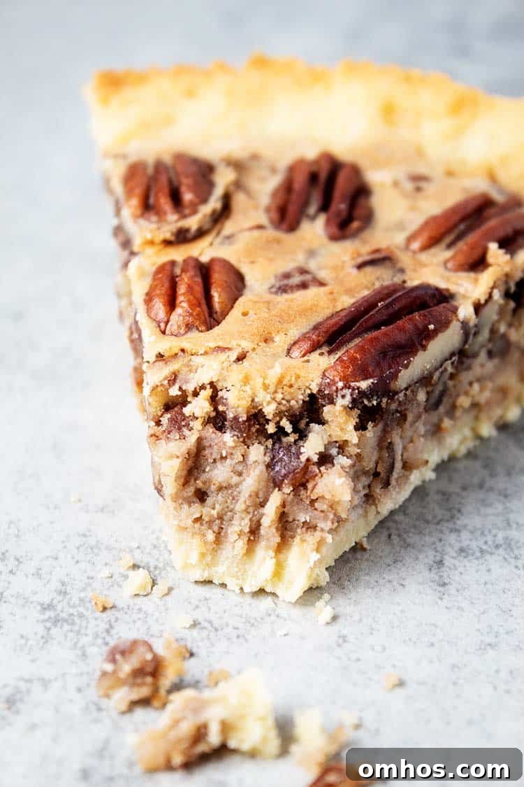 slice of keto pecan pie with piece missing