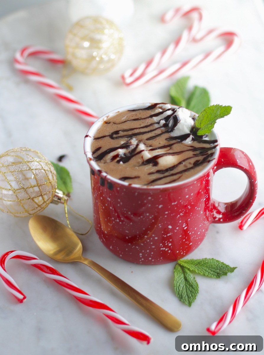 Cozy AIP Peppermint Hot Cocoa Recipe (Paleo) and Waiting Well 6 AIP Peppermint Hot Cocoa (Paleo) - piping hot 'cocoa' made with carob is topped with creamy clouds of peppermint whipped cream and a dark carob drizzle