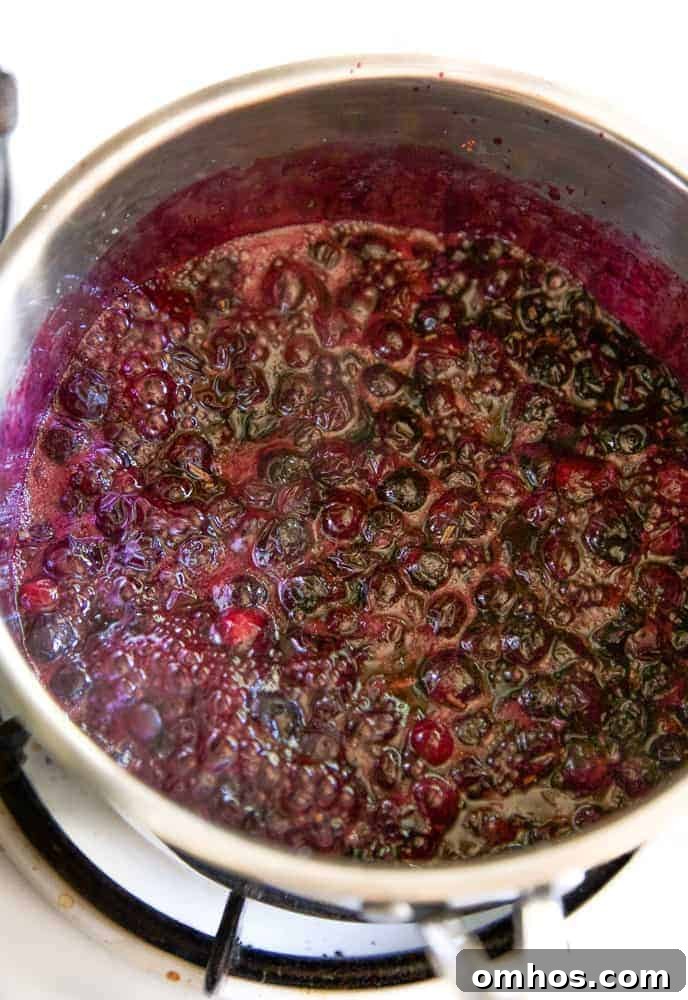 blueberry bourbon bbq sauce simmering in a pot
