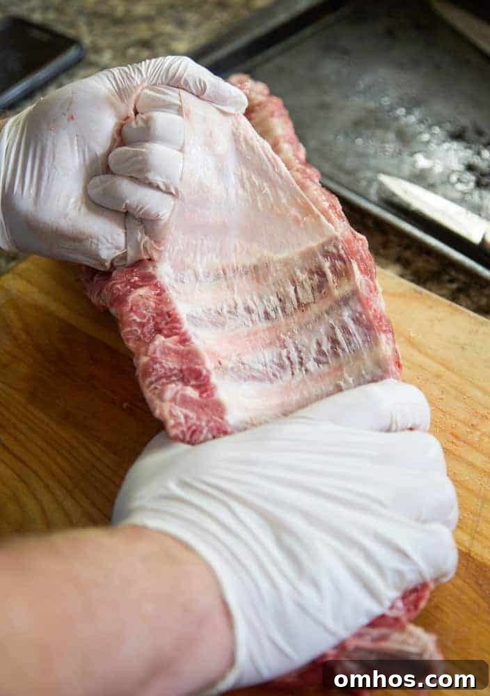 pulling the silver skin from the back of the rib rack