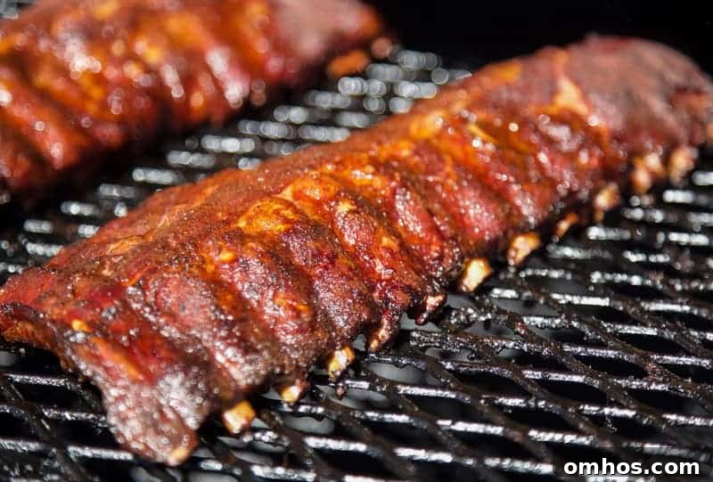 Bones retracting on smoked ribs. 3-2-1 method.