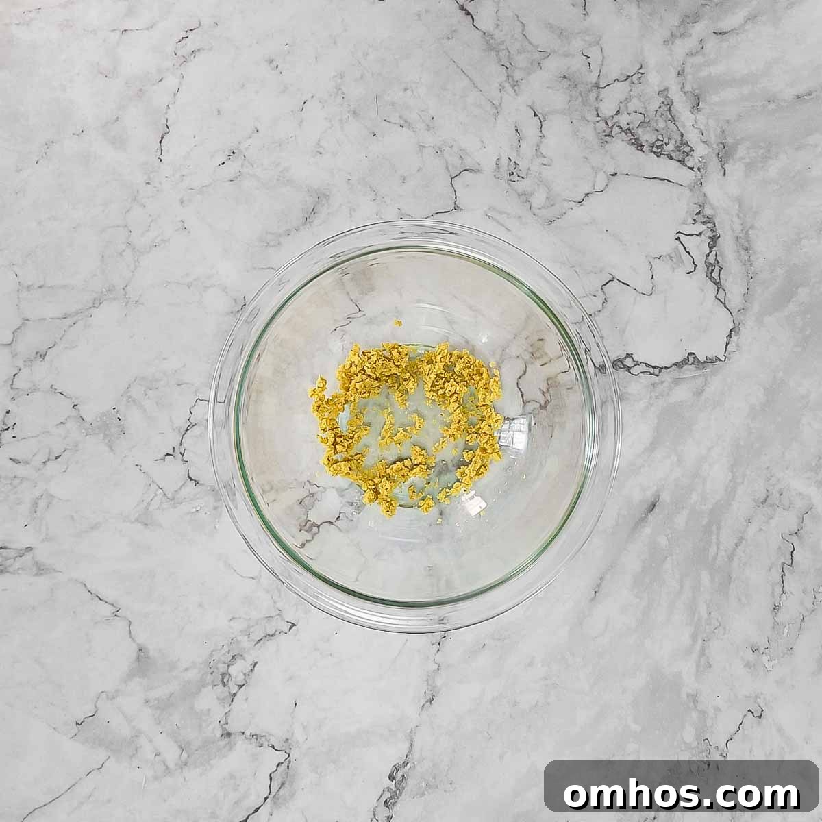 Overhead view of process shot 1 - crushing bouillon cube into powder.