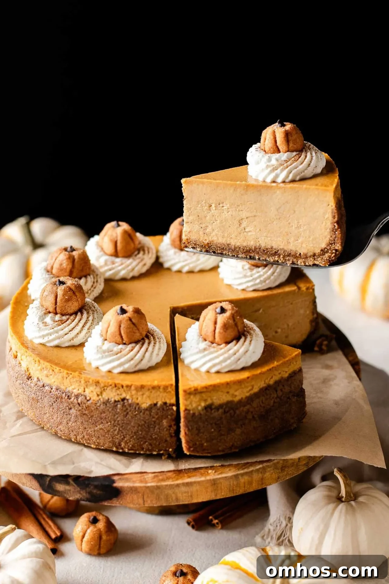 Creamy Pumpkin Cheesecake Recipe 6 pumpkin cheesecake slice being lifted up on cake server