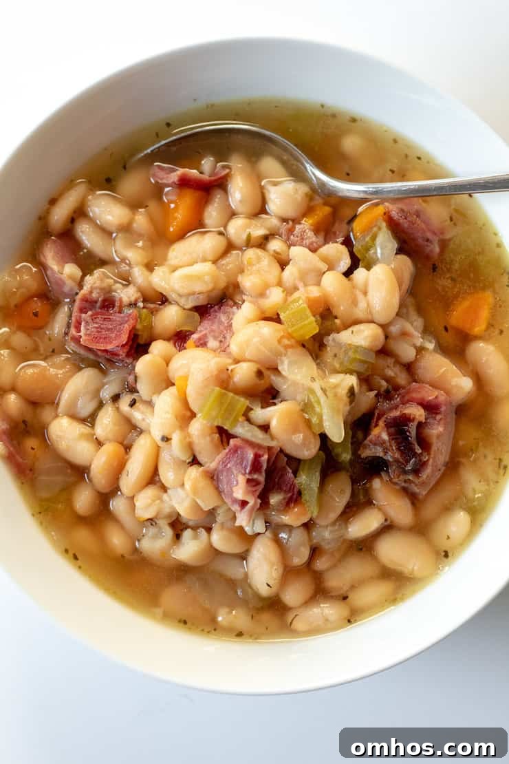 Hearty Instant Pot Ham and White Bean Soup 4 Overhead closeup of soup in bowl.