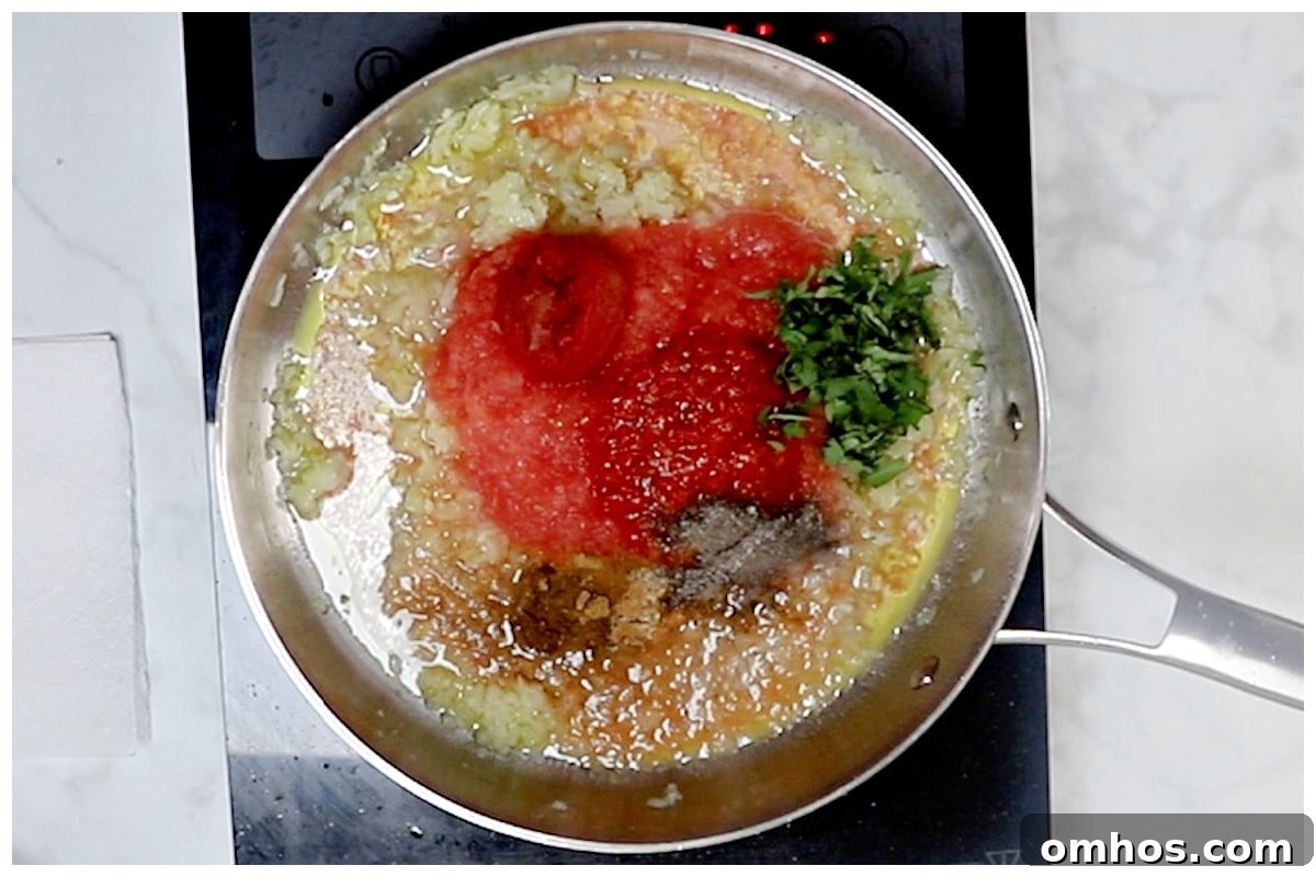 A skillet with harissa pasta sauce in a skillet.