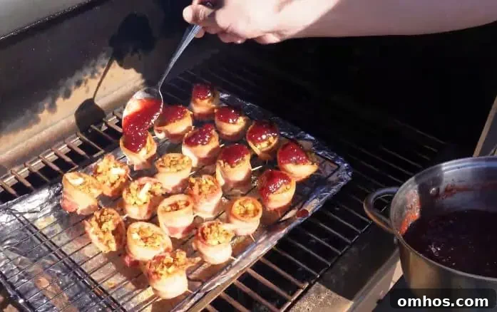 topping turkey shots with cranberry sauce on grill